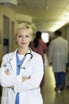 Doctor standing in hallway smiling